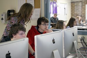 JHS teacher Kayla Bousum works with a students in one of her classes.