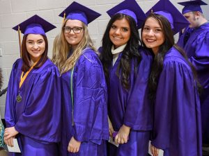 Johnston graduates Mikaela Beckley, Ciara Becker, Mirnesa Becirovic and Adnana Becirovic. Photo courtesy of Merle Laswell/The Des Moines Register.